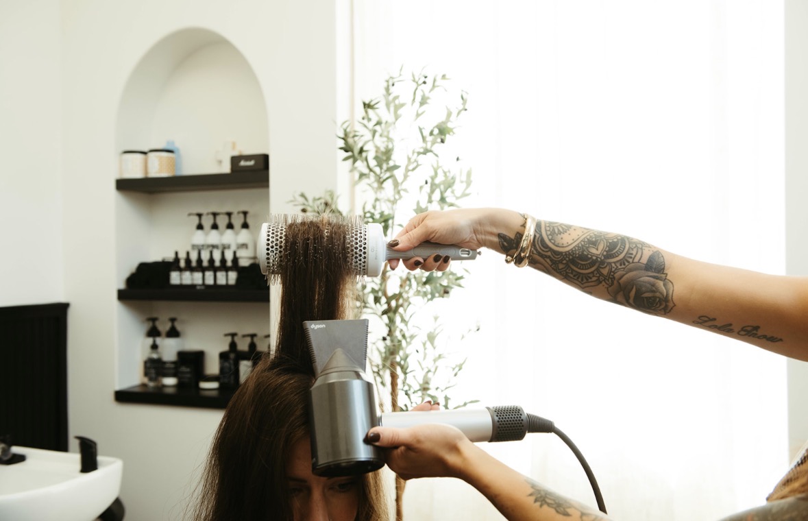 A blow-dry finish at Mane Haven with the Davines shelf behind