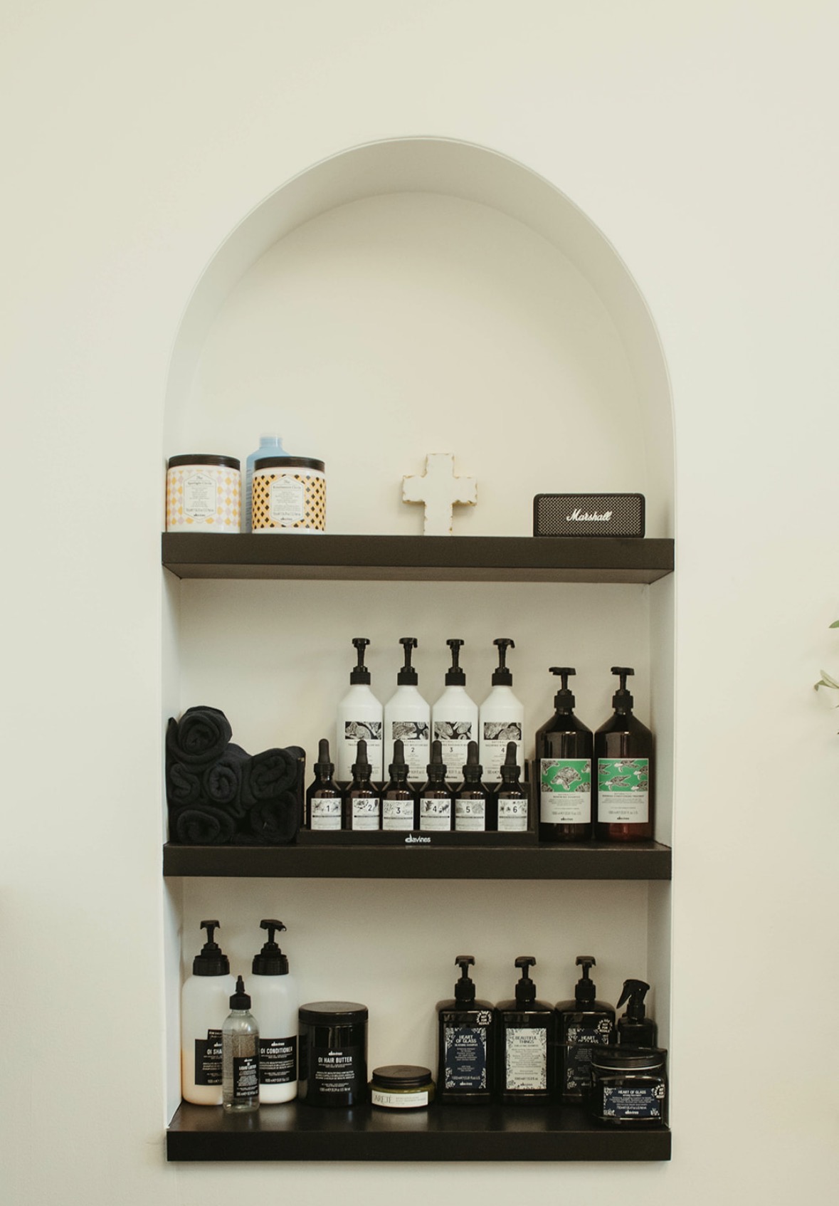 Arched niche stocked with Davines hair care products